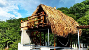 Cabin with balcony and ocean view.